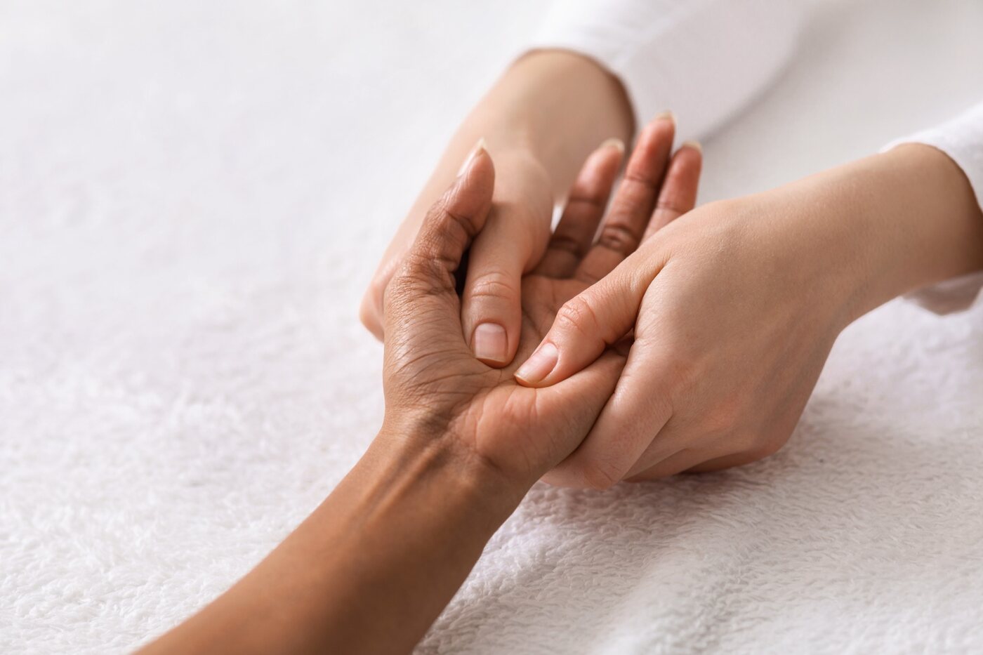 Hands receiving specialized hand therapy
