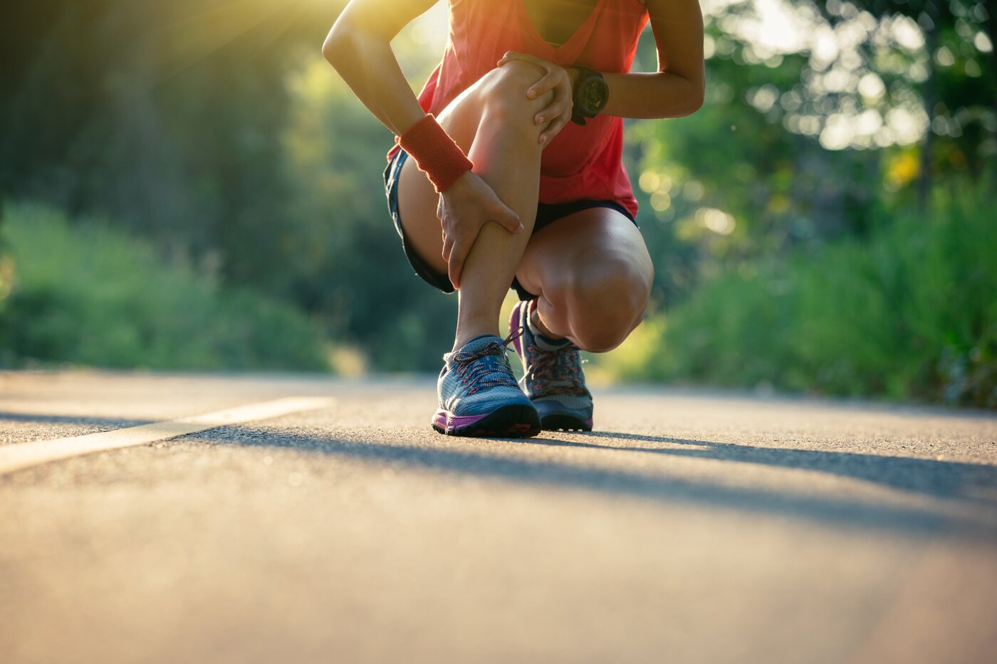 Runner holding an injured knee